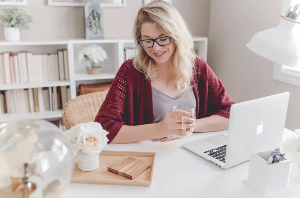 Lady working at a laptop.